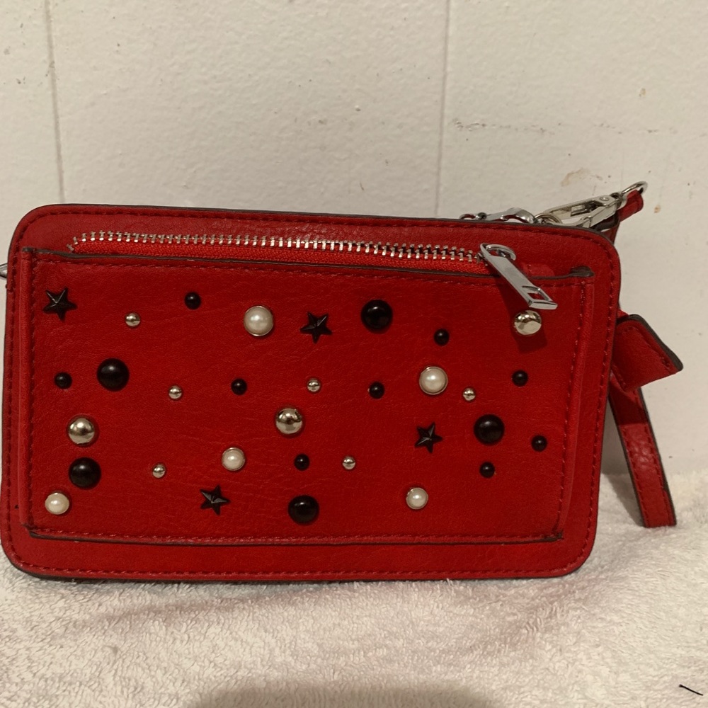 Carlos Santana crossbody and wristlet